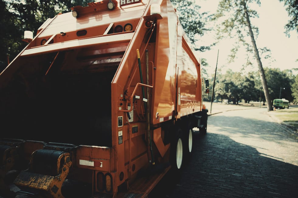 waste recycling truck driving