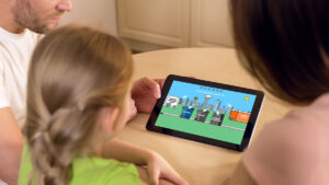 a family playing the Routeware waste sorting game together